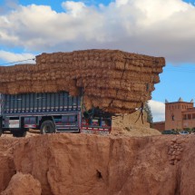 The fully loaded truck from the back with a Kasbah like hotel